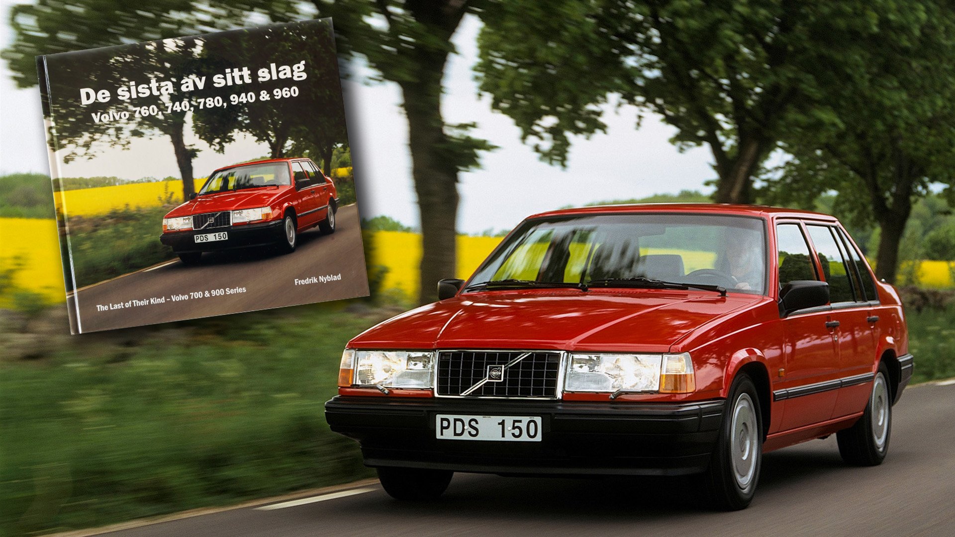 Röd Voldo 940 Sedan på sommarväg intill rapsfält