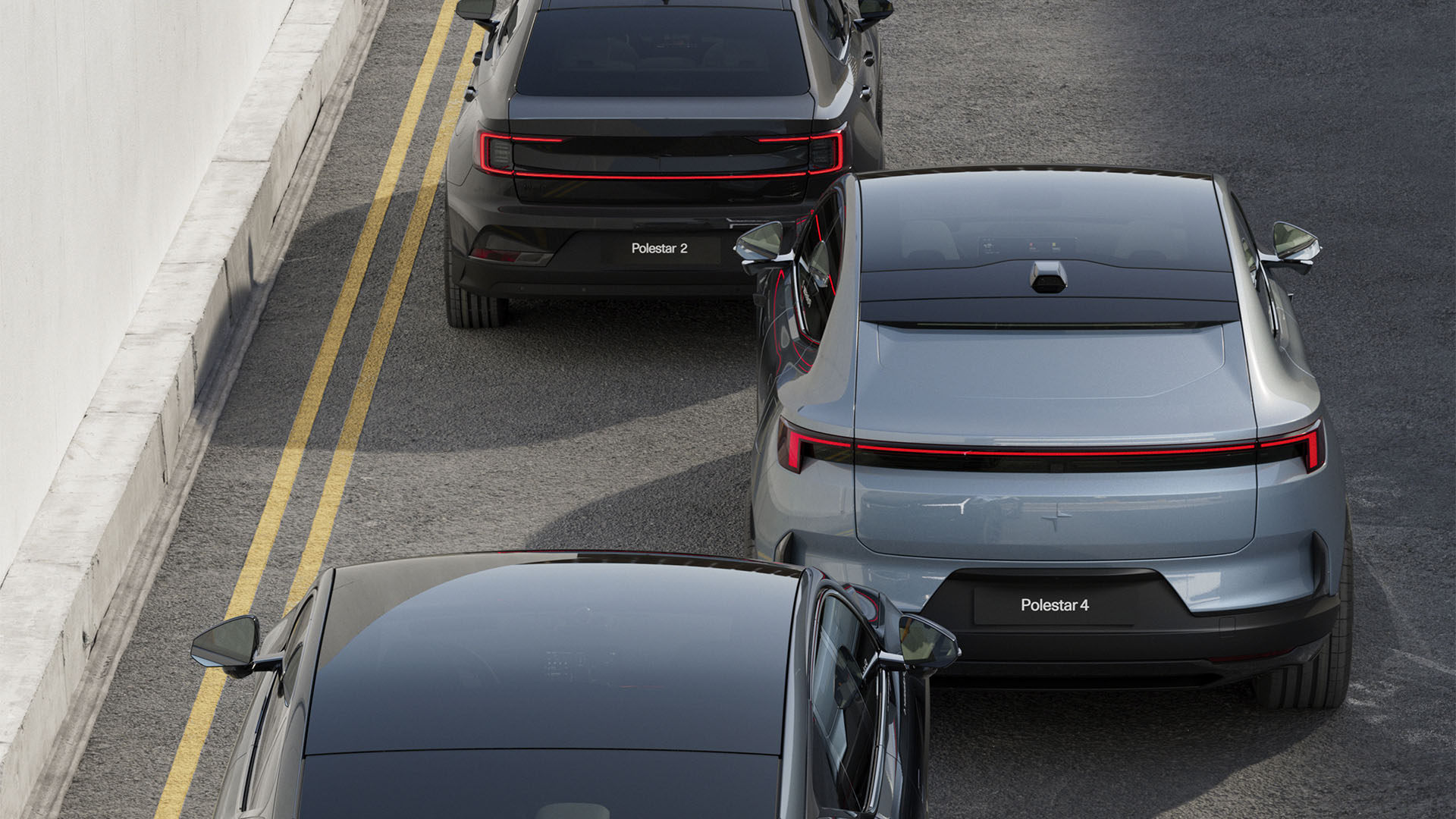 Bild på en Polestar 2 och Polestar 4 som åker bort från bilden.