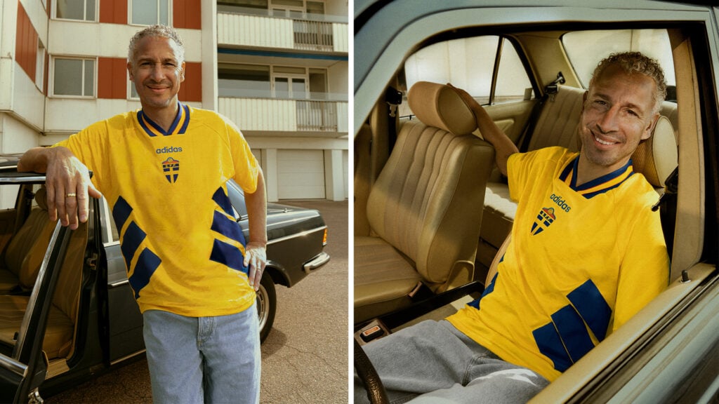 Henrik Larsson iklädd en Adidas-VM-tröja poserar med brun Mercedes-Benz W123.