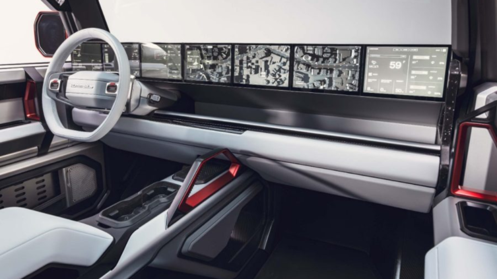 Förarmiljön i Hummer X präglas av en digitaliserad och mycket flexibel layout. De stapelbara skärmarna kan anpassas helt efter förarens behov och visar bland annat realtidsdata från bilens integrerade terrängdrönare. Foto: GMC