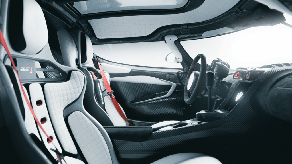 Interiören präglas av funktionell minimalism med skalstolar, sexpunktsselar och en analog Chronocluster. Foto: Koenigsegg
