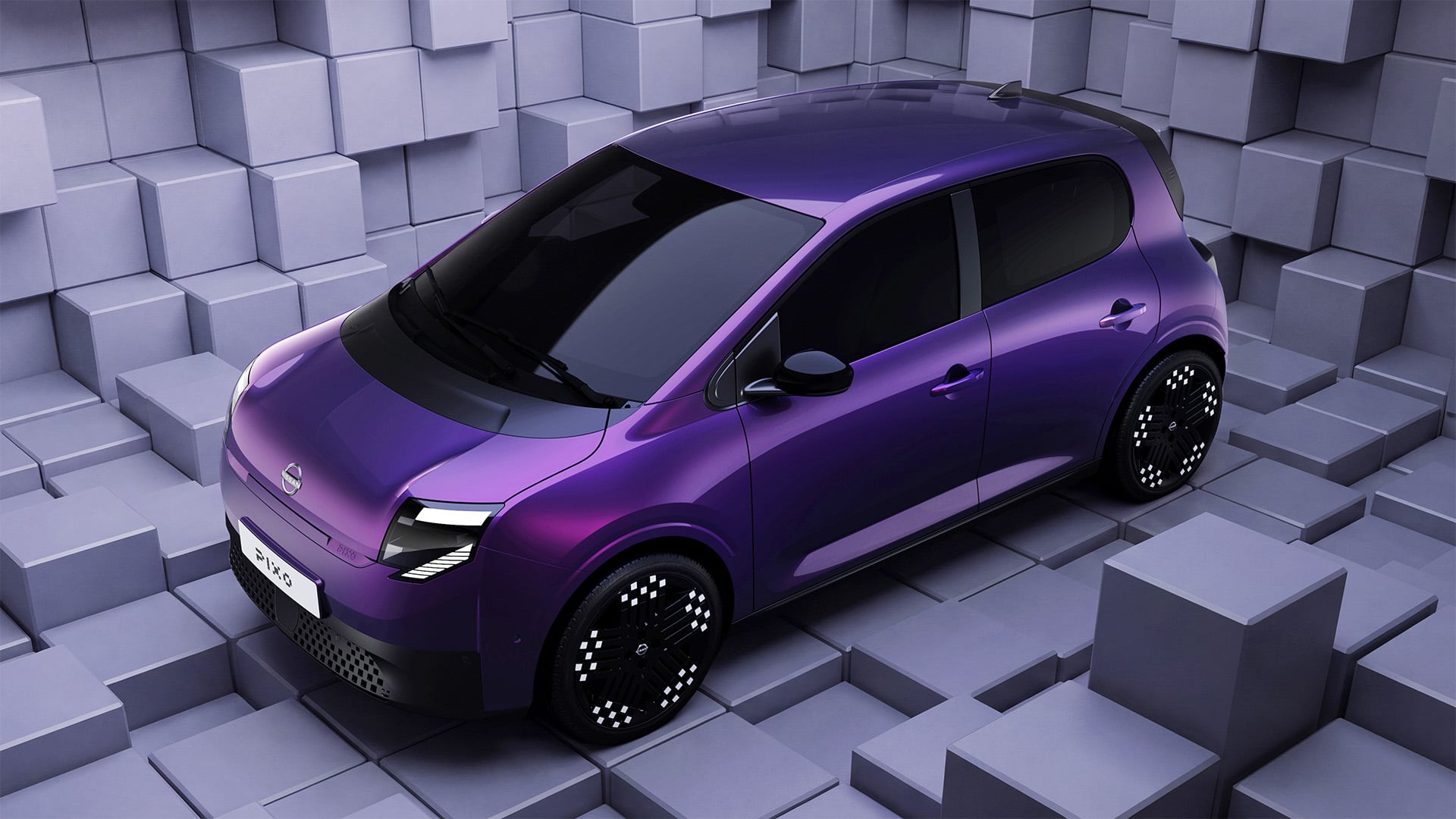 Lila Nissan Pixo snett framifrån.