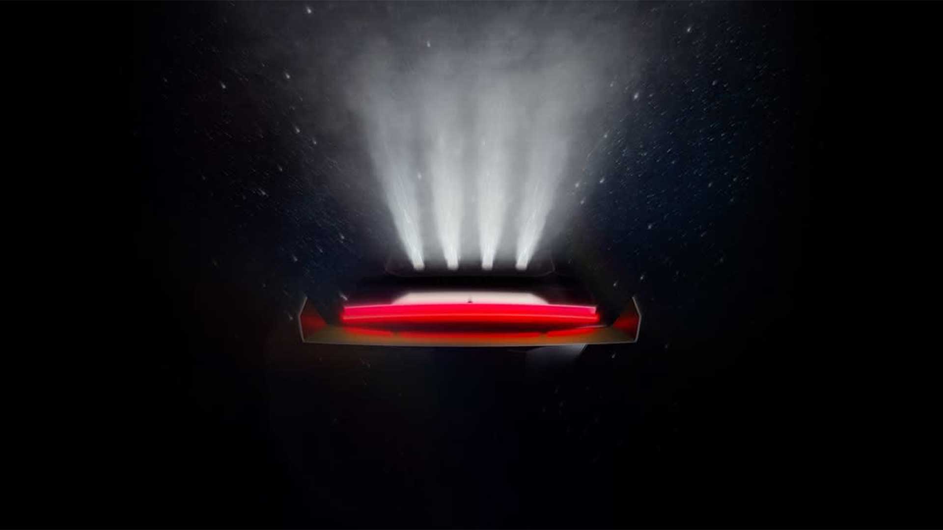 Teaserbild på Tesla Roadster i mörker.