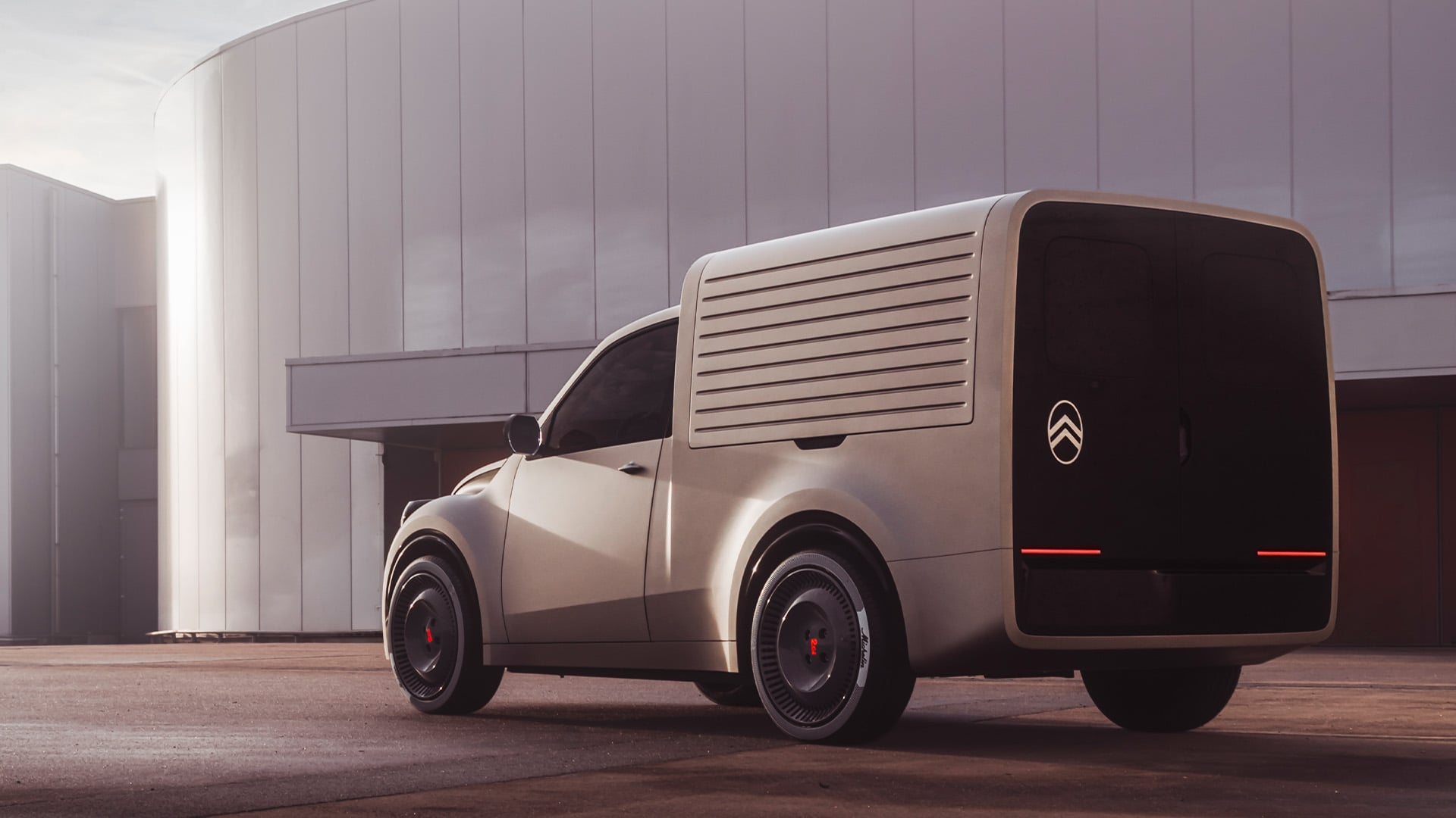 Citroën 2 CV Fourgonnette Concept snett bakifrån mot betongmiljö.